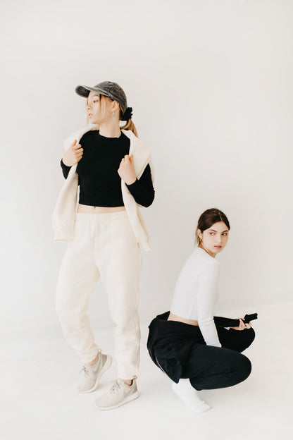 Two girls with sweatsuits and long sleeve shirts
